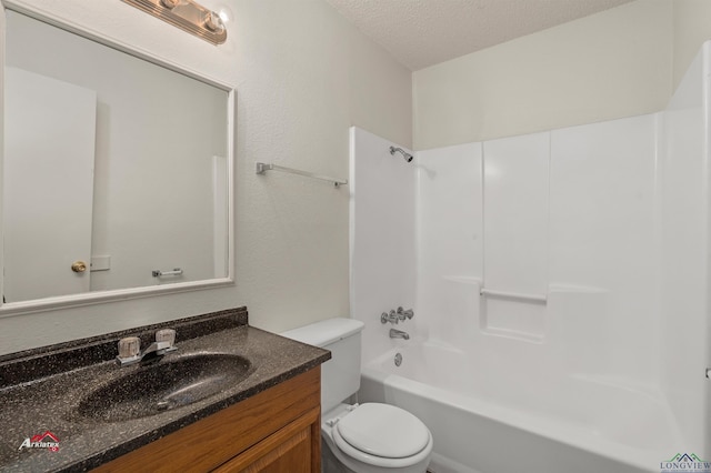 full bathroom featuring vanity, toilet, a textured ceiling, and bathtub / shower combination