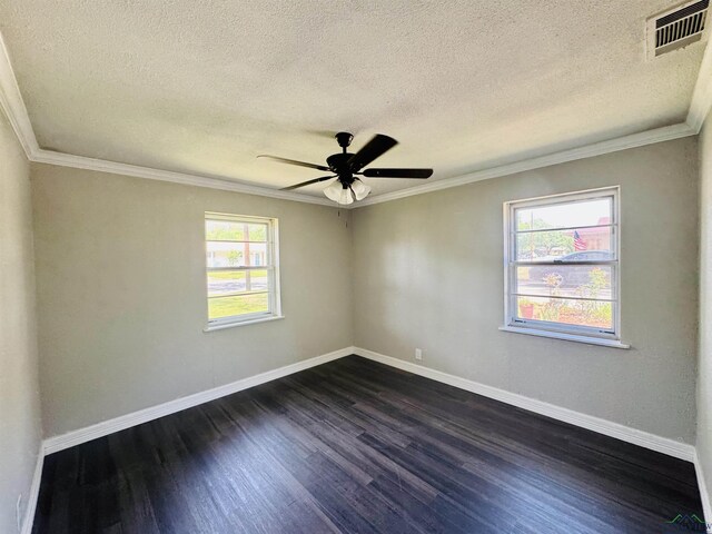 2317 Kaynell Dr, Henderson, TX 75654 - spare room featuring a textured ceiling, dark wood-style flooring, baseboards, and visible vents