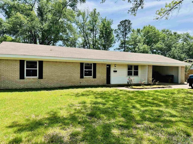 2317 Kaynell Dr, Henderson, TX 75654 - ranch-style home featuring brick siding, a front lawn, and a carport