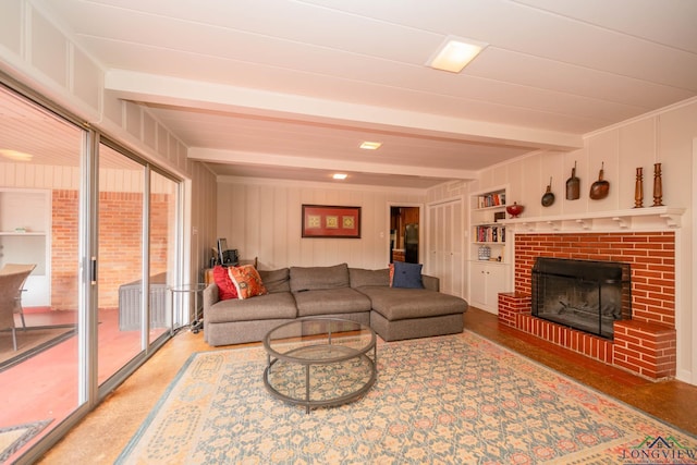 604 Woodcrest Ln, Longview, TX 75601 - living room featuring beam ceiling, a brick fireplace, and built in shelves