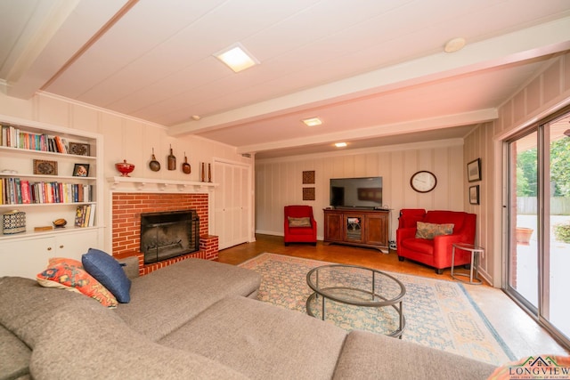 604 Woodcrest Ln, Longview, TX 75601 - living area featuring beamed ceiling, a brick fireplace, and wood finished floors