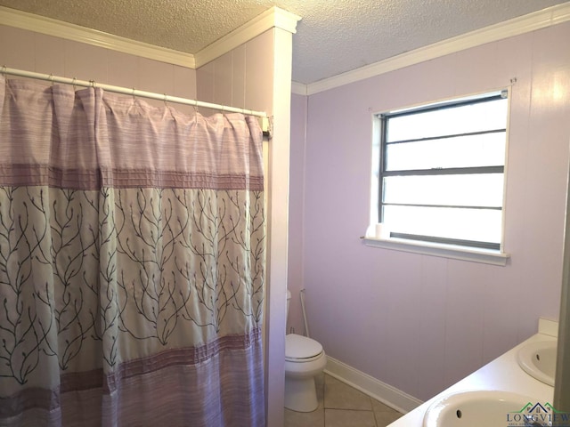 bathroom with crown molding, tile patterned flooring, vanity, and a textured ceiling