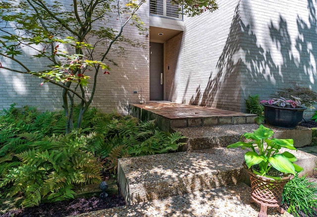 property entrance with brick siding