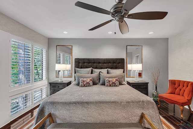 bedroom with a ceiling fan, recessed lighting, and wood finished floors