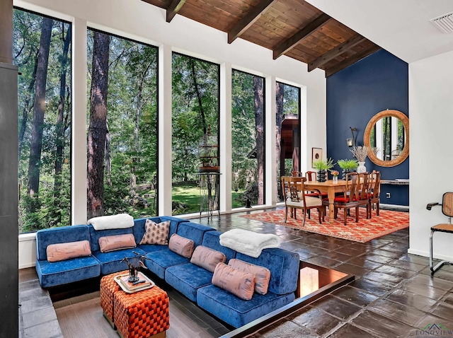 sunroom featuring visible vents and beam ceiling