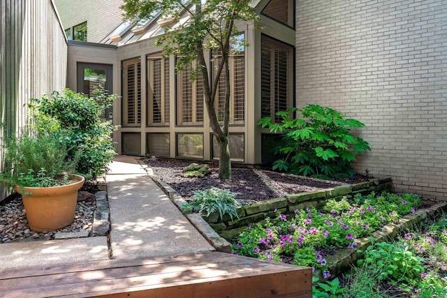 entrance to property with brick siding