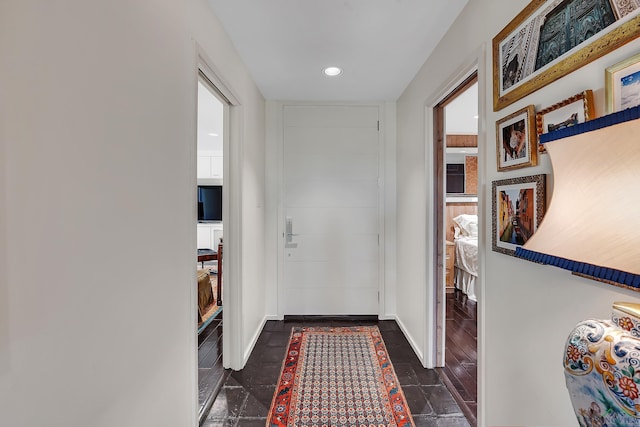 interior space featuring baseboards and recessed lighting