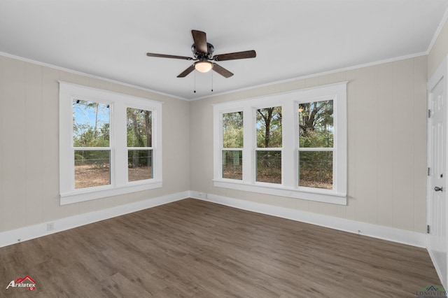 empty room featuring crown molding, ceiling fan, and dark hardwood / wood-style floors