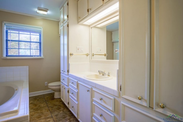 bathroom with tile patterned flooring, vanity, toilet, and a washtub