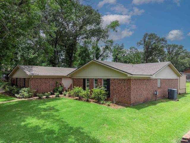 2713 Northridge Dr, Longview, TX 75605 - ranch-style home featuring brick siding, central AC, a front lawn, and a shingled roof