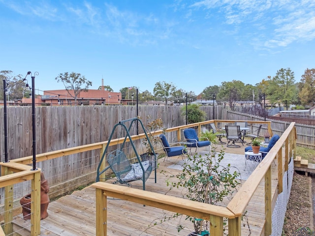 2713 Northridge Dr, Longview, TX 75605 - wooden deck with a fenced backyard
