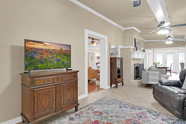 2713 Northridge Dr, Longview, TX 75605 - living area featuring a ceiling fan, ornamental molding, light tile patterned flooring, baseboards, and a fireplace