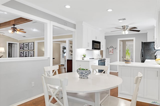 2713 Northridge Dr, Longview, TX 75605 - dining space featuring a ceiling fan, baseboards, wood finished floors, ornamental molding, and recessed lighting