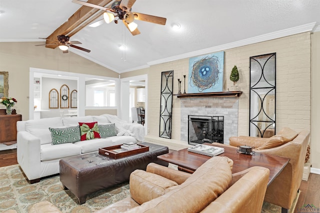 2713 Northridge Dr, Longview, TX 75605 - living area featuring wood finished floors, ceiling fan, a fireplace, and ornamental molding