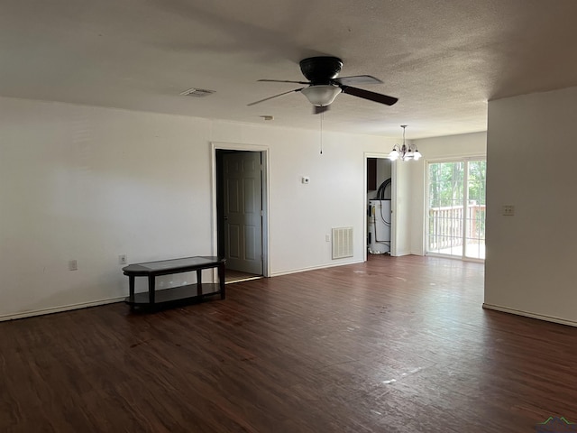 unfurnished room with dark hardwood / wood-style flooring and ceiling fan with notable chandelier