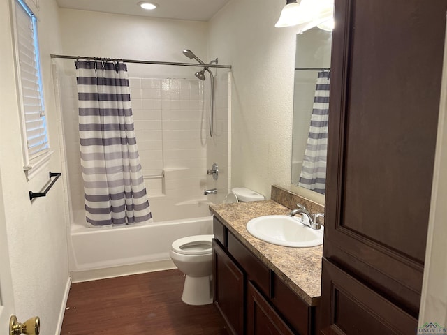 full bathroom featuring toilet, vanity, shower / bath combo, and hardwood / wood-style flooring