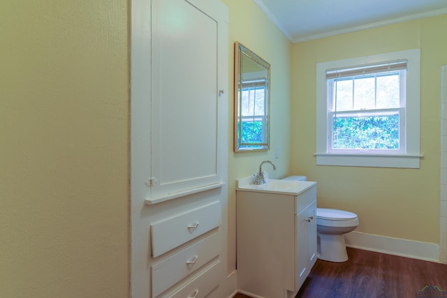215 S Sidney St, Longview, TX 75602 - bathroom featuring ornamental molding, vanity, wood finished floors, toilet, and baseboards