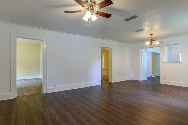 215 S Sidney St, Longview, TX 75602 - empty room featuring a chandelier, dark wood-style flooring, baseboards, ceiling fan, and ornamental molding