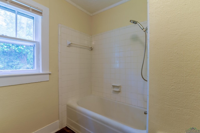 215 S Sidney St, Longview, TX 75602 - bathroom featuring crown molding, a textured wall, bathing tub / shower combination, and baseboards