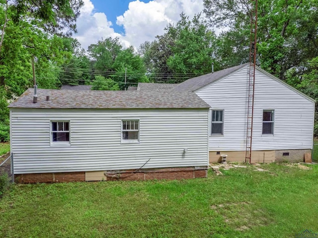215 S Sidney St, Longview, TX 75602 - view of property exterior featuring crawl space, a lawn, and roof with shingles
