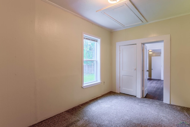 215 S Sidney St, Longview, TX 75602 - spare room with attic access, carpet floors, and ornamental molding