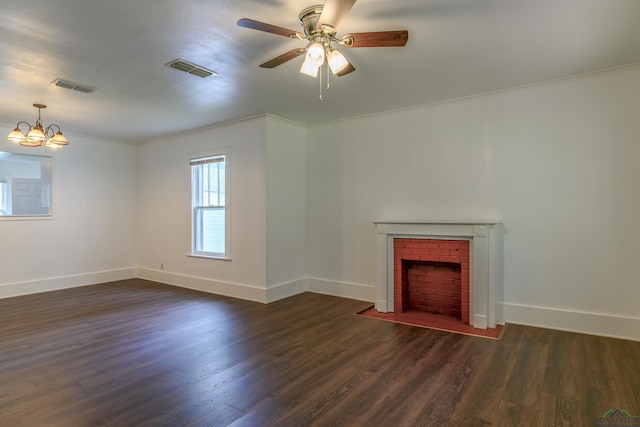 215 S Sidney St, Longview, TX 75602 - unfurnished living room with a brick fireplace, dark wood-style flooring, ornamental molding, and baseboards