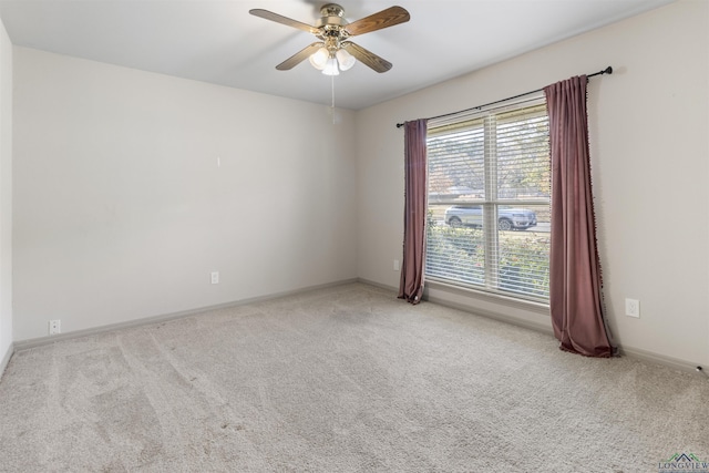 carpeted empty room with ceiling fan