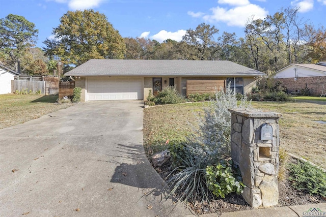 ranch-style home with a front yard and a garage