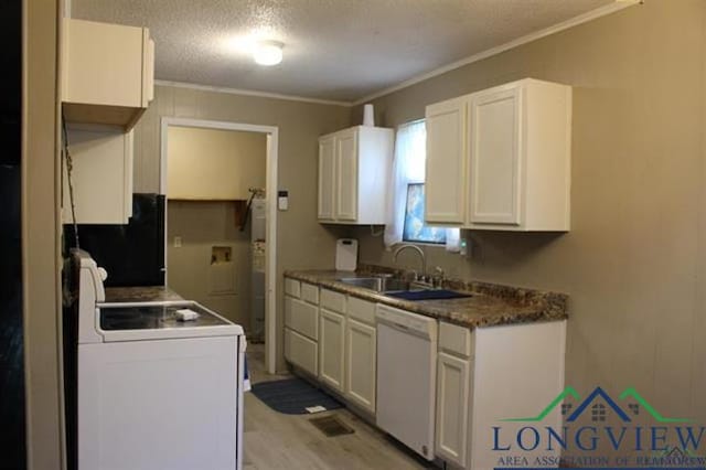 kitchen featuring ornamental molding, a textured ceiling, white appliances, sink, and white cabinets