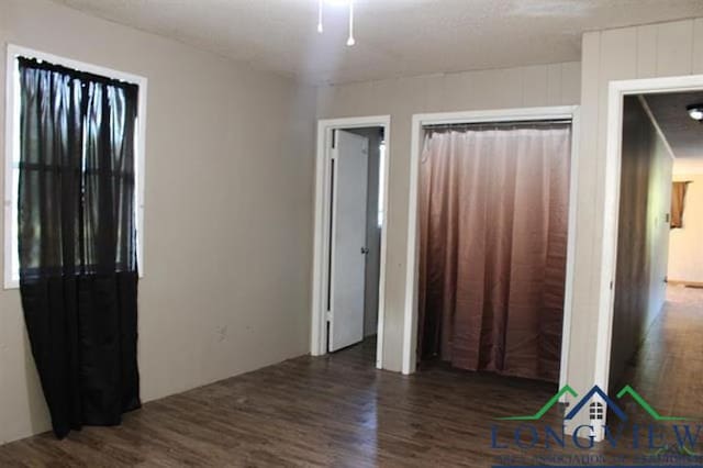 empty room featuring dark hardwood / wood-style floors