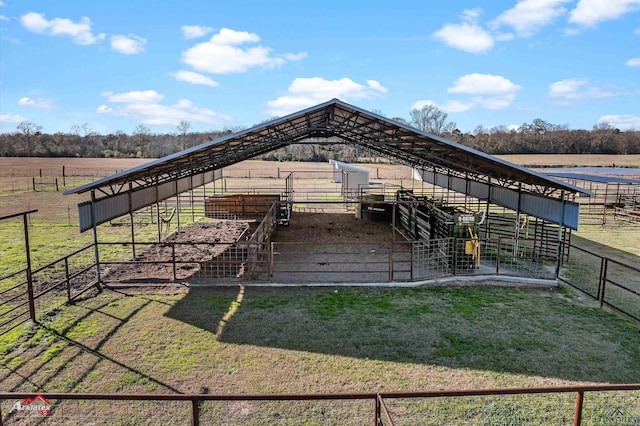 view of horse barn featuring a rural view