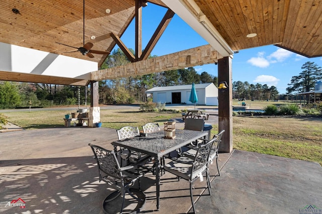 view of patio / terrace featuring an outdoor structure and ceiling fan