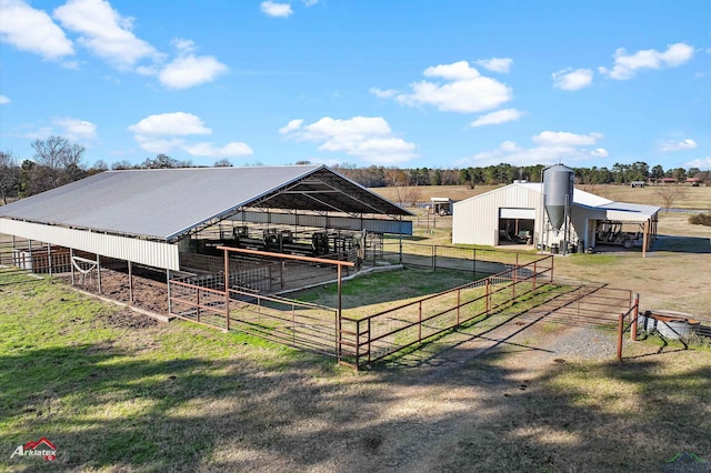 view of horse barn featuring a rural view