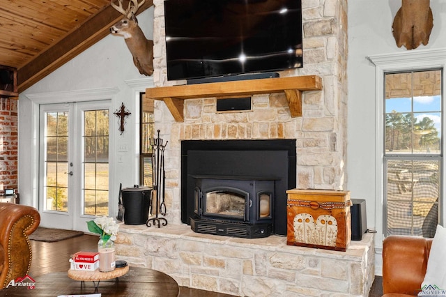 details featuring hardwood / wood-style flooring, french doors, and a wood stove