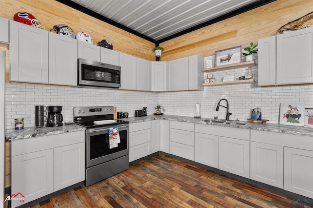 kitchen featuring sink, stainless steel appliances, and white cabinets