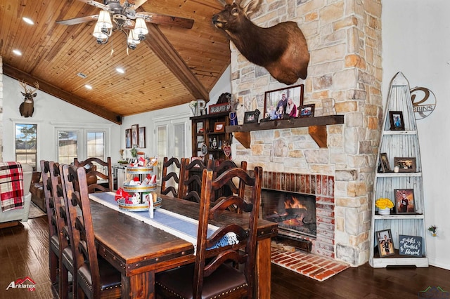 dining area with hardwood / wood-style flooring, high vaulted ceiling, a fireplace, and wood ceiling