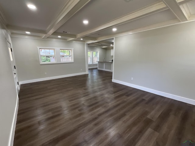 spare room with beamed ceiling, baseboards, recessed lighting, ornamental molding, and dark wood-type flooring