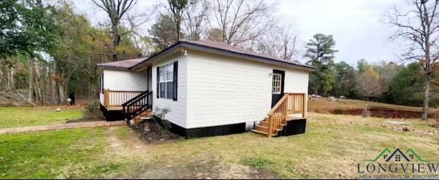 view of property exterior featuring a lawn