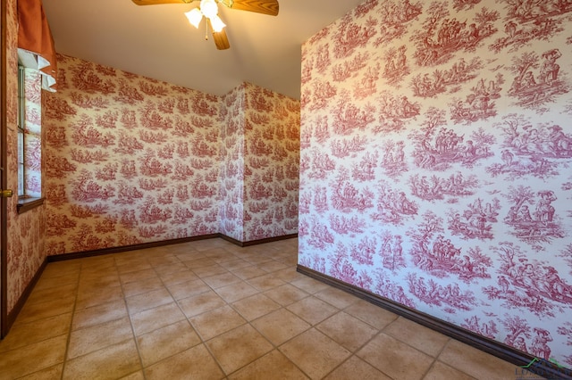 unfurnished room featuring wallpapered walls, ceiling fan, and baseboards