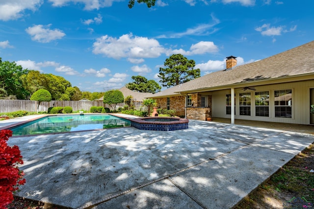view of swimming pool featuring a fenced in pool, a patio, an in ground hot tub, and a fenced backyard