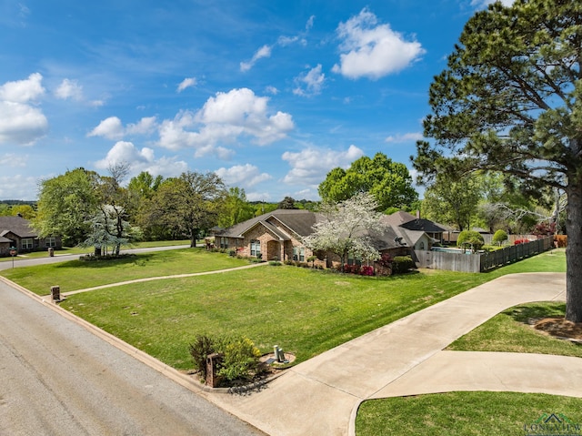 view of front of property with a front yard and fence