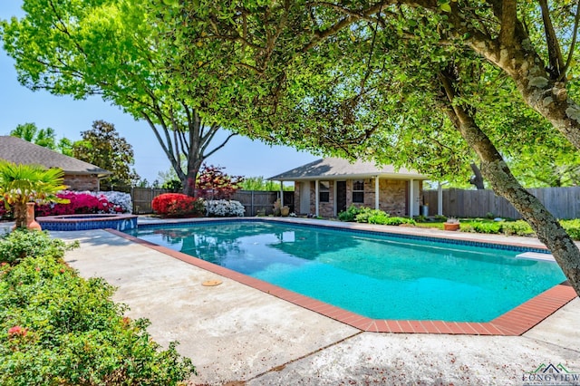 view of swimming pool with a fenced in pool, a patio, an outdoor structure, an in ground hot tub, and a fenced backyard