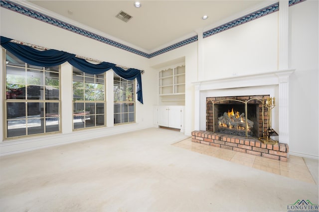 unfurnished living room featuring crown molding, a brick fireplace, visible vents, and recessed lighting