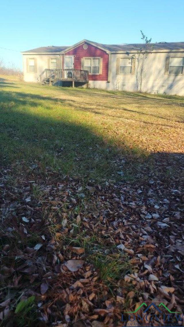 view of yard with a wooden deck