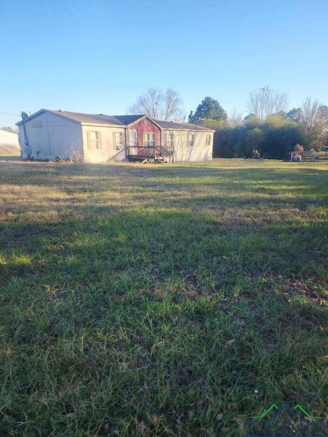 view of yard featuring a wooden deck