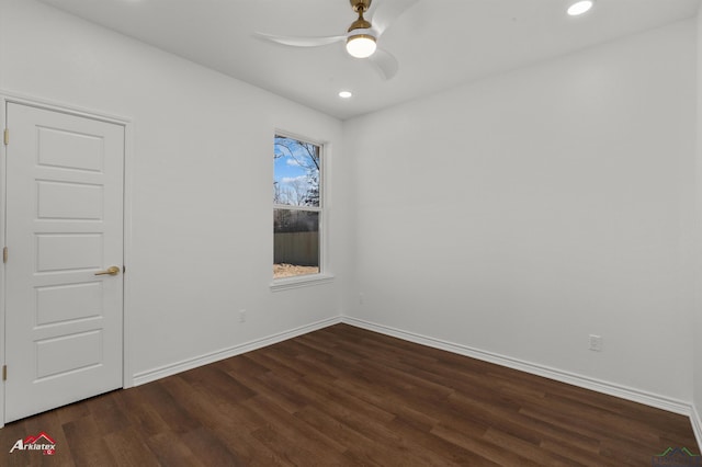 unfurnished room featuring ceiling fan and dark hardwood / wood-style flooring