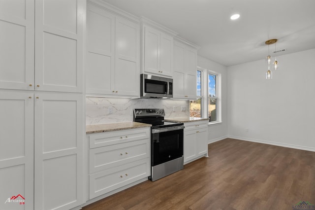 kitchen featuring stainless steel appliances, tasteful backsplash, dark hardwood / wood-style flooring, decorative light fixtures, and white cabinets