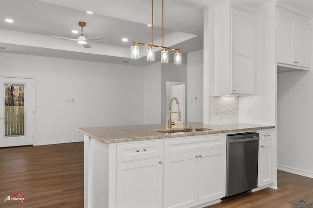 kitchen with white cabinets, sink, ceiling fan, tasteful backsplash, and light stone counters