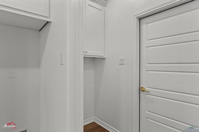 washroom with dark hardwood / wood-style flooring