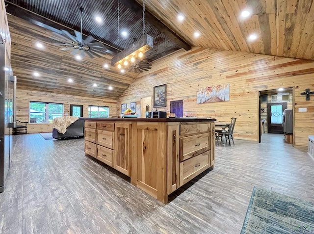 interior space featuring dark hardwood / wood-style flooring, wood ceiling, pendant lighting, and wood walls